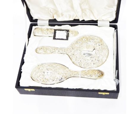 Modern silver dressing table set, 4 pieces : mirror, brush, clothes brush and comb, all scroll and mask repousse, Birmingham 