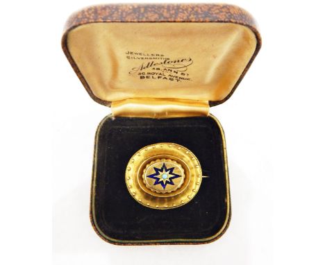 Victorian gold-coloured brooch of oval form with ropetwist and bead border, the centre boss with blue enamel star and turquoi