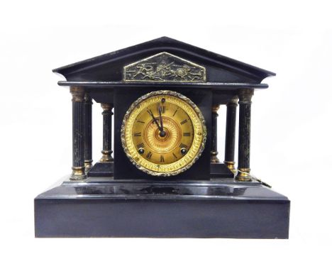 Victorian slate mantel clock, of temple design supported by columns, the gilded dial with Roman numerals 31cm high 