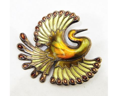 Norwegian silver and enamel brooch by David Andersen, depicting a phoenix enamelled in oranges and greens 