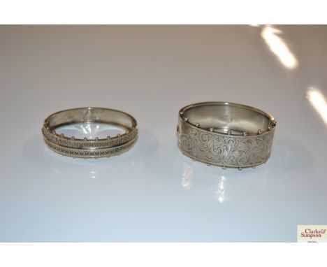 A Victorian silver bangle, Birmingham 1893; and another unmarked 