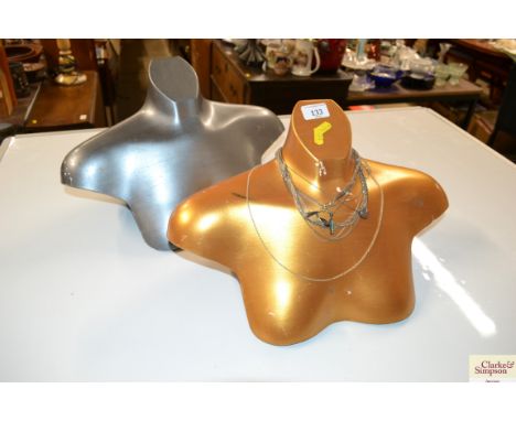 Two mannequin type display stands and a quantity of white metal fine link necklaces and pendants