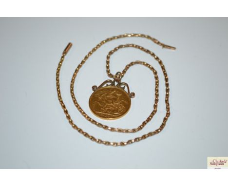 A 1910 sovereign with 9ct gold mount and chain 