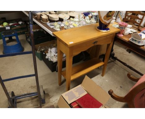 A light oak hall table fitted single drawer and under tier