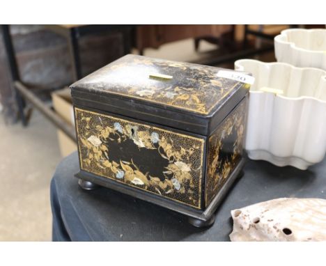 A papier mâché and lacquer two compartment tea caddy