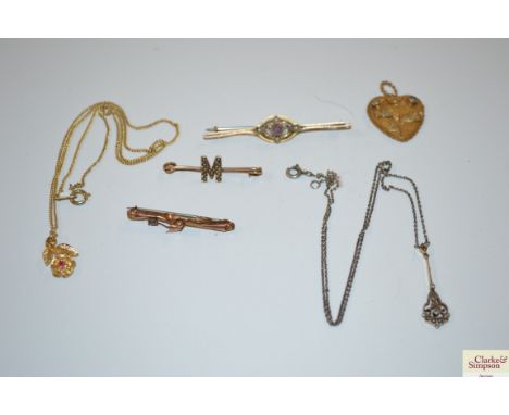 Three bar brooches; a yellow metal chain; a heart shaped pendant etc.