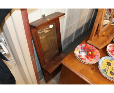 An Edwardian mirrored wall shelf 