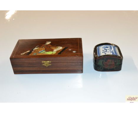 An Oriental inlaid wooden trinket box and a papier mâché and porcelain trinket box 