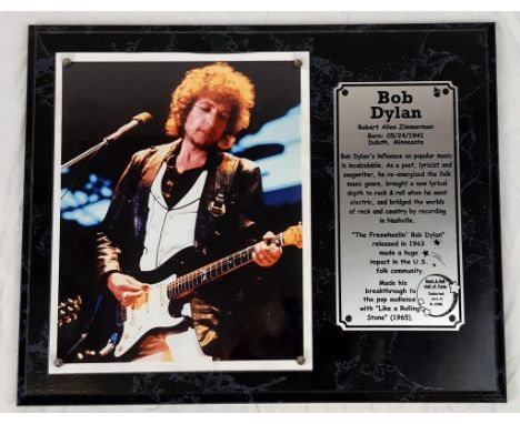 A Bob Dylan Playing Guitar Picture (circa 1980s) and an Informative Plaque. On wood base - 39 x 31cm. 