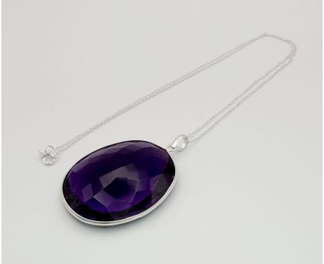 A 105ct Hydro Amethyst Gemstone Pendant in a bezel setting, 925 silver. 40mm x 37mm. Comes with a disappearing silver necklac
