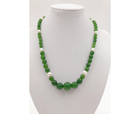 A Graduated Jade and Freshwater Pearl Necklace. Faceted Olive-Green Jade interspersed with bright white freshwater pearls. 42