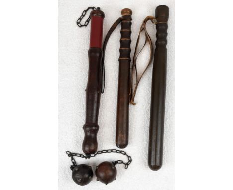 Four Decorative Wall Hanging Armaments. To Include: Two wood truncheons, a spiked wood ball mace and a Wilkinson Sword which 