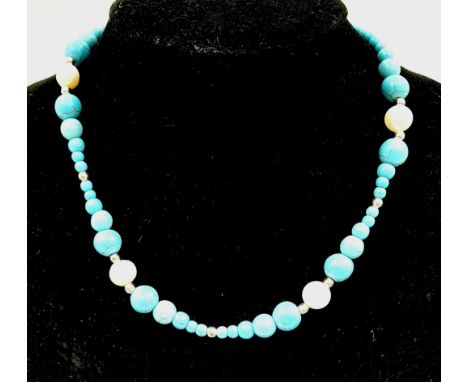 A Cultured Freshwater Pearl and Graduated Turquoise Howlite Necklace. 38cm. 