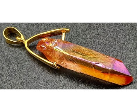 A Titanium Stone Pendant set in a gilded attachment.4cm. 