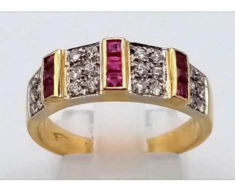 an 18k yellow gold diamond and ruby ring.  5.1gms  size 0 
