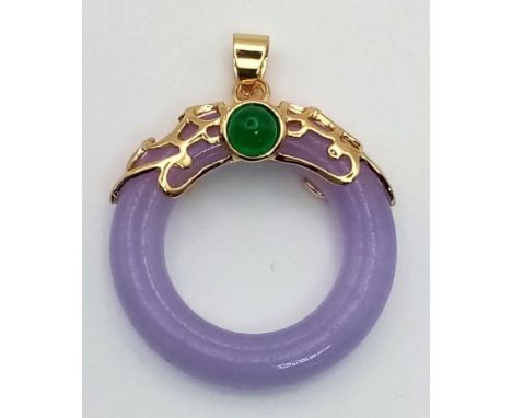 A Lavender Jade Dough Nut Pendant in a Gilded Setting.3cm. 