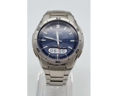 A Casio Wave Ceptor Quartz Gents Watch. Stainless steel strap and case - 42mm. Blue dial with multi-function window. In worki