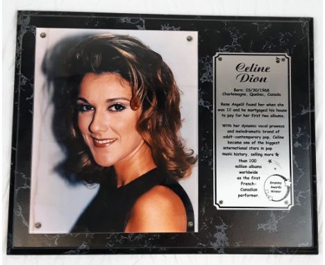 A Celine Dion Picture (circa 1990s) and an Informative Plaque. On wood base - 39 x 31cm. 