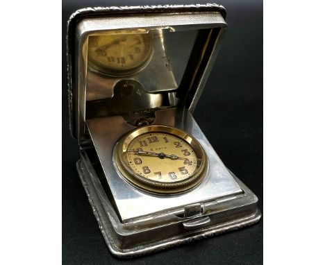 An Antique Solid Silver Engine Turned Travelling Clock. Hallmarks for Birmingham 1929. 6.5 x 7.5cm. 175g total weight. In goo