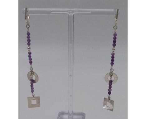A PAIR OF SILVER AND AMETHYST DROP EARRINGS. 5.4gms 