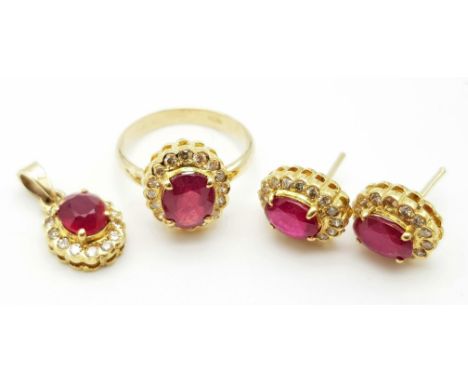 A Glorious 14K Yellow Gold, Ruby and Diamond Jewellery Set - All with an identical wonderful design of a large ruby surrounde