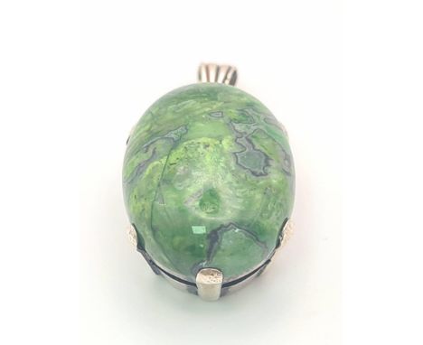 A Mottled Jade Pendent set in Silver. 3cm 