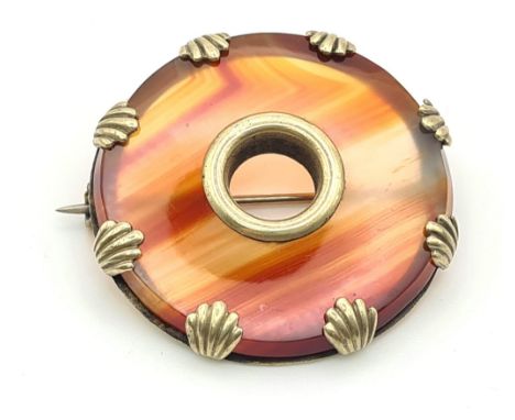 A Celtic Agate Dough-Nut Brooch - Set in yellow metal.3.5cm. 