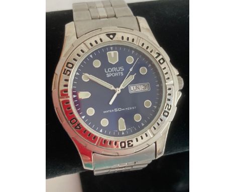 Gentlemans LORUS  sports watch. Blue face model with quartz movement.Sweeping second hand with day/date window. Divers bezel 