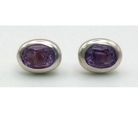 A Pair of 925 Silver and Amethyst Stud Earrings. 