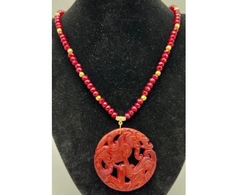 An unusual, Chinese, reddish brown jade amulet depicting a scene from the ancient myth The Beauty and The Beast. (A theme met
