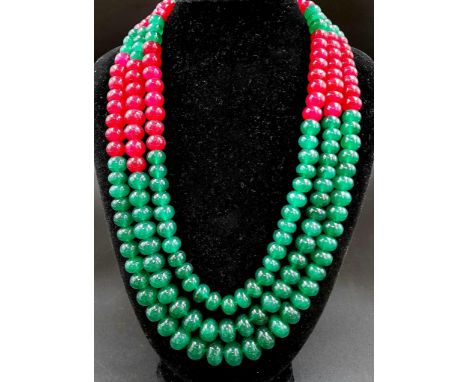 A Vivid 100ct Three-Strand Ruby and Emerald Bead Necklace. Beads - 10mm. 46cm. 