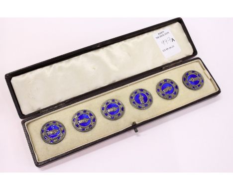 A cased set of six enamel buttons.