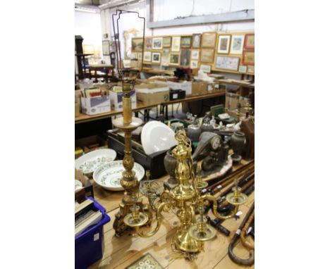 A large brass five branch chandelier and a gilt plaster lamp.