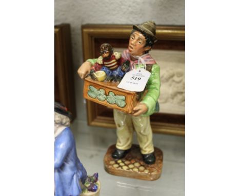 A Royal Doulton figure "Organ Grinder" HN2173.
