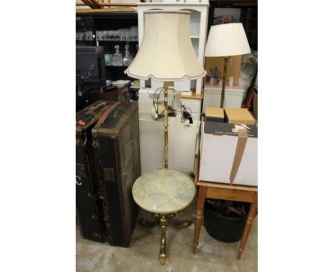 An onyx and brass occasional table and similar standard lamp.