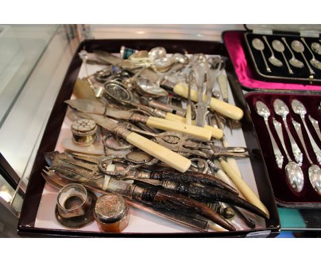 A good collection of silver and other items to include grape scissors, teaspoons, button hooks etc. etc.