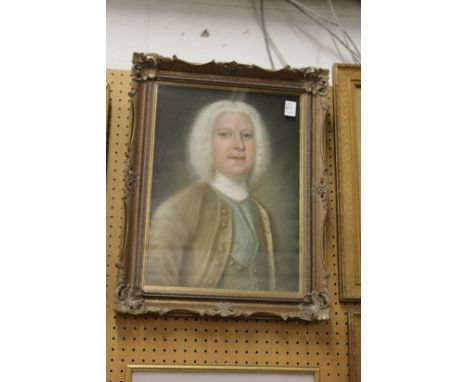 A portrait of a distinguished looking gentleman with a white wig in a decorative frame.