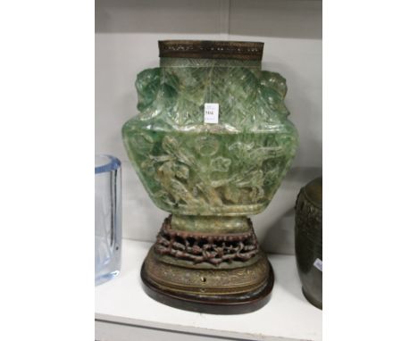 An unusual large Chinese carved jadeite vase on stand (converted to a lamp).