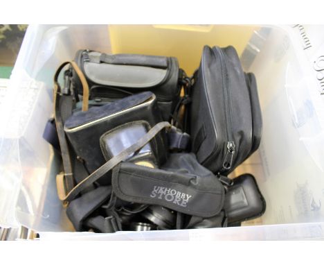 A quantity of old cameras and camera equipment.