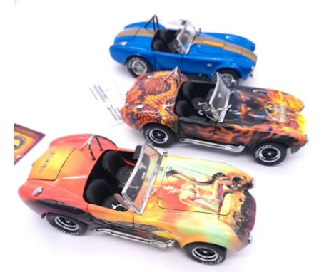 Franklin Mint, a boxed group of 1:24 scale Shelby Cobra models comprising of Cobra 427 S/C "Mistress OF Fire", Shelby Cobra "