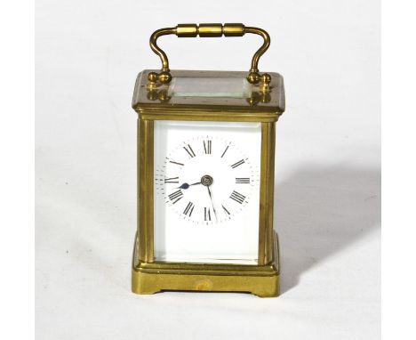 A small brass carriage clock