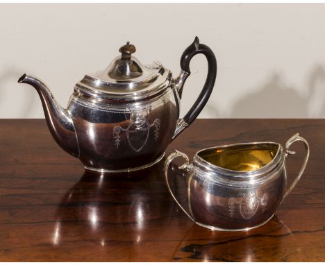 A silver teapot and sugar bowl, total weight 740 grams