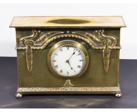 An Arts & Crafts Glasgow style brass mantle clock