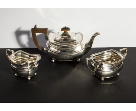 A three piece silver tea service, Chester 1928 Total weight 1045 grams