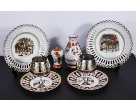 Two ribbon plates with hunting design, pair of silver plated goblets, two Noritake saucers and two others