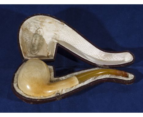 A Meerschaum pipe with amber mouthpiece in fitted leather case