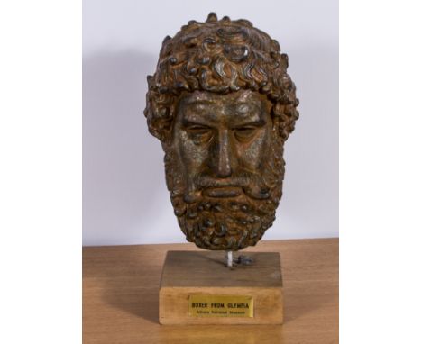 A replica bronze portrait head of a boxer believed to be Satyros of Elis 330-320 BC forund at Olympia in Greece in 1880. Heig