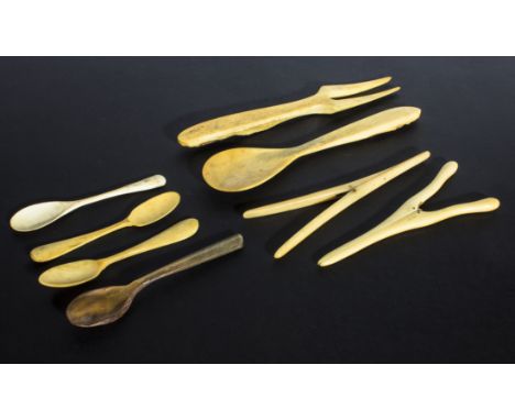 Two pairs of bone glove stretchers, five bone spoons and a fork