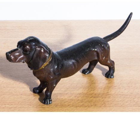 A soft metal cigarette lighter modelled as a dog