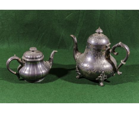 A pewter coffee pot and teapot